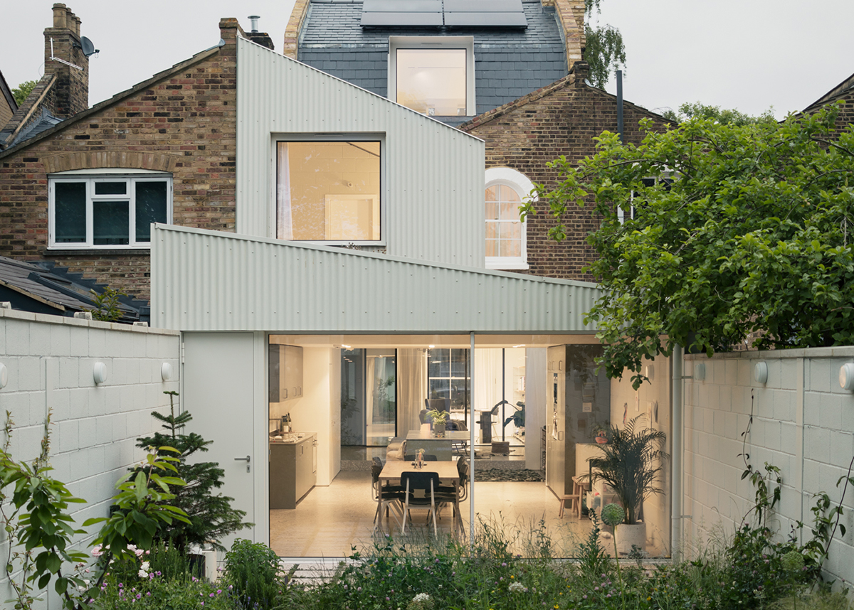 A modern white kitchen extension.